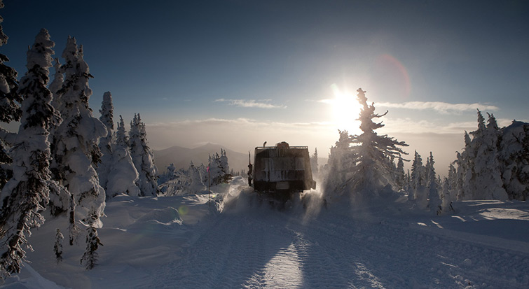 Big Red Snow Cat Setting Sun